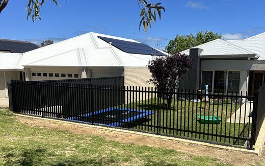Black tubular front fence outside a newly built Perth home