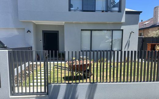 Black tubular front fence outside a modern Perth townhouse