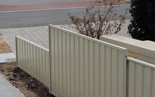 New cream Colorbond fence along a street verge in Perth