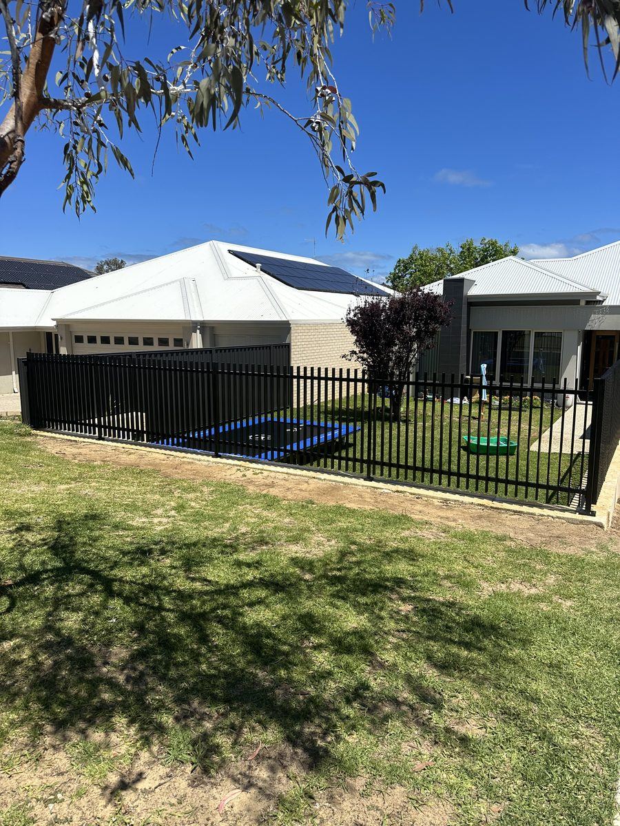 Black tubular front fence outside a newly built Perth home
