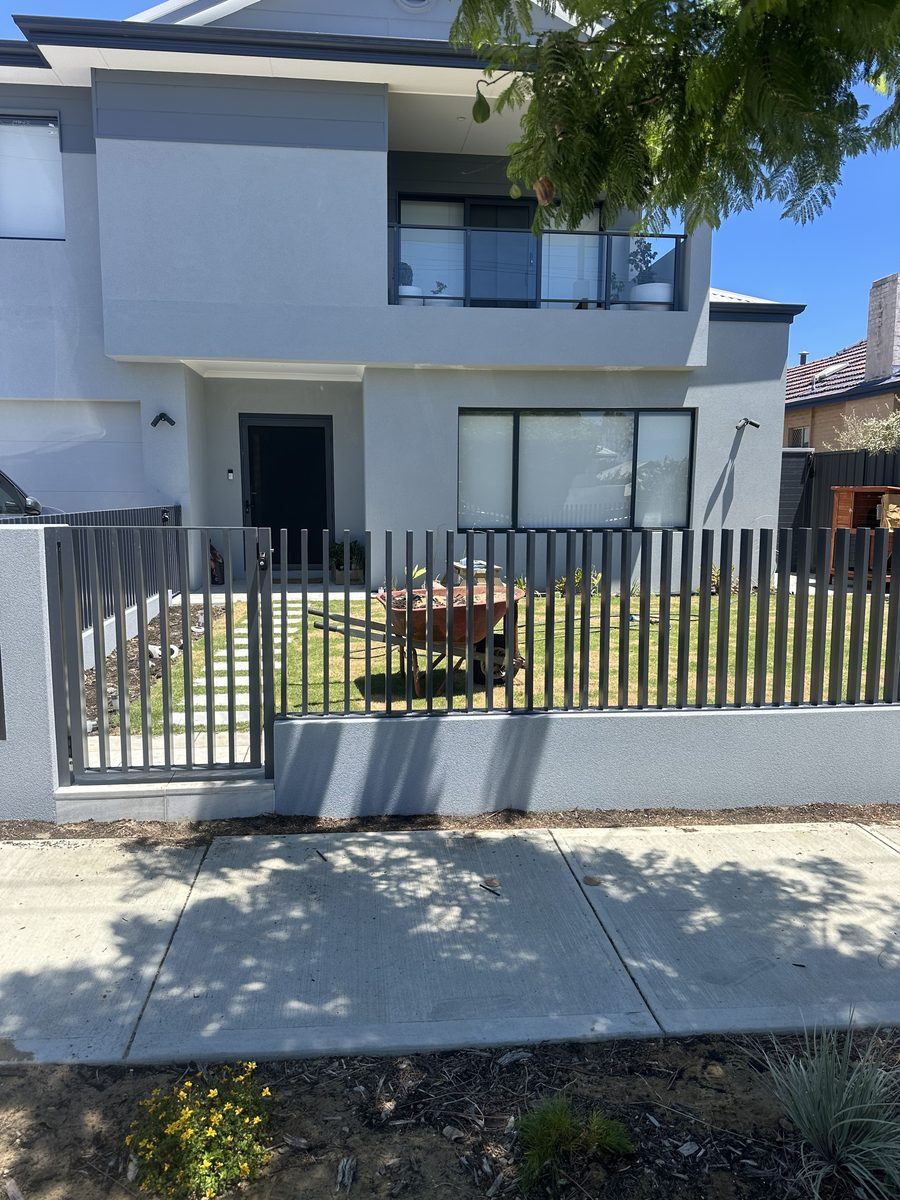 Black tubular front fence outside a modern Perth townhouse