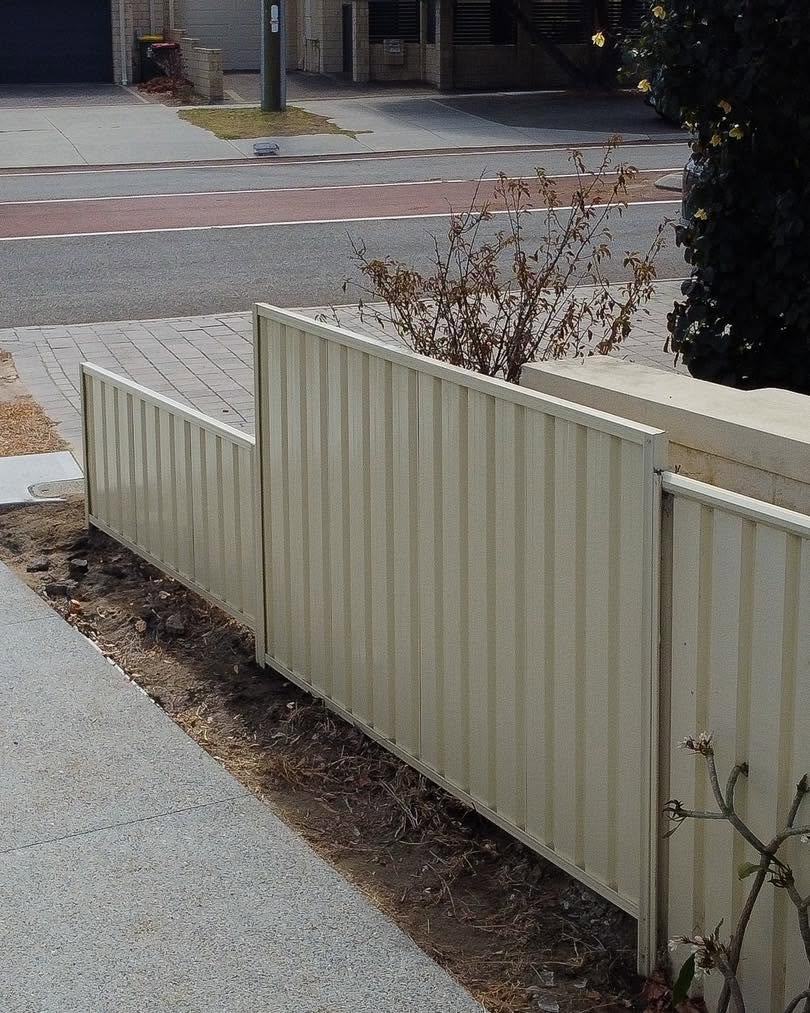 New cream Colorbond fence along a street verge in Perth